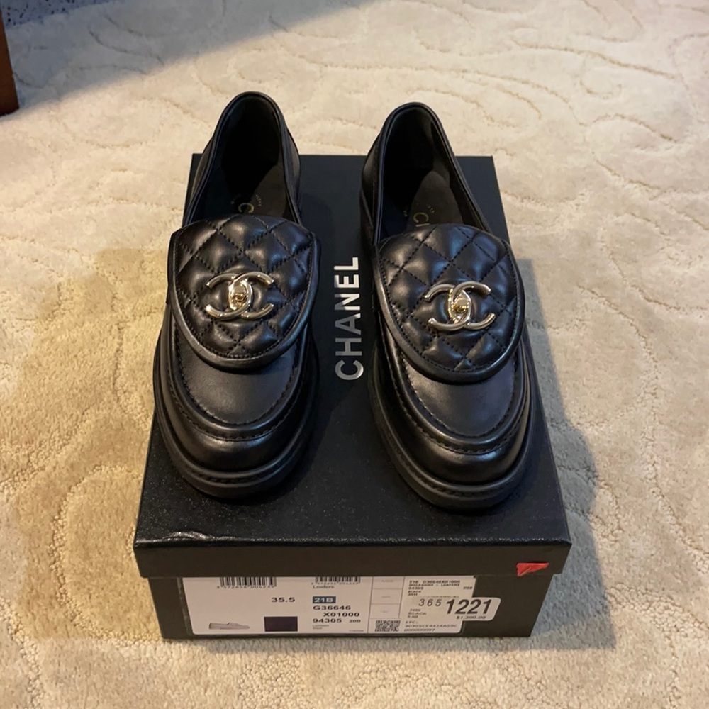 Never worn brand new chanel turn lock loafers in black